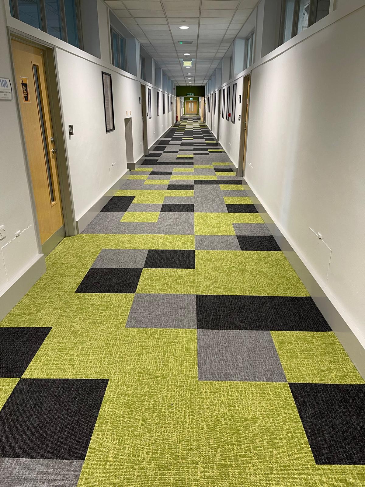 Carpet tiles 2 Corridor with lime green, grey and black patterned carpet tiles