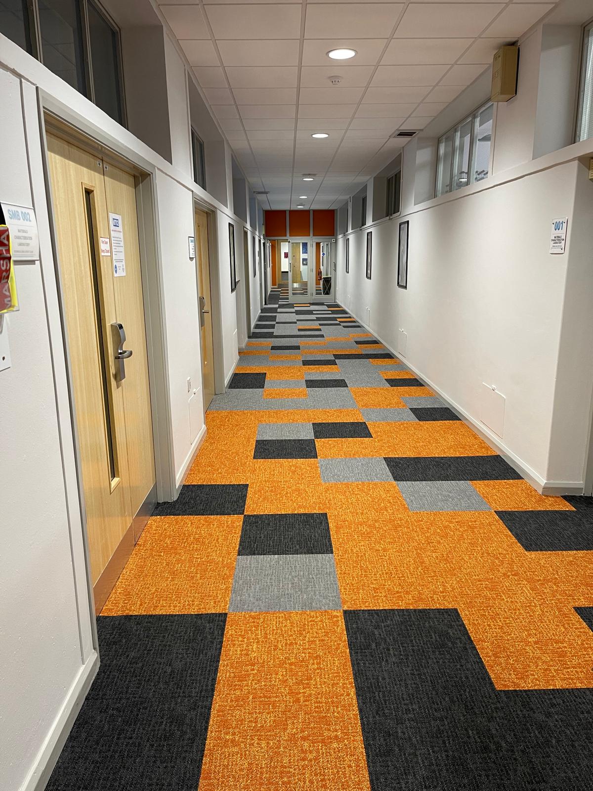 Carpet tiles 7 School corridor with orange, grey and black patterned carpet tiles