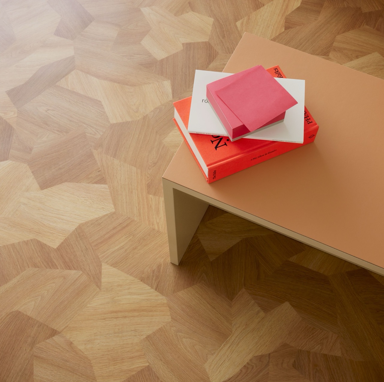 Close-up of Sarlon natural shaped wood-effect flooring with a coffee table