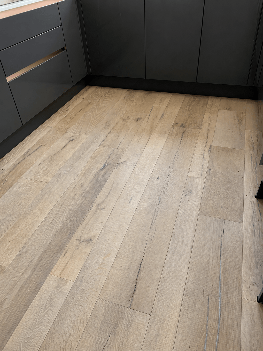 Light grey-oak wood flooring in a modern room